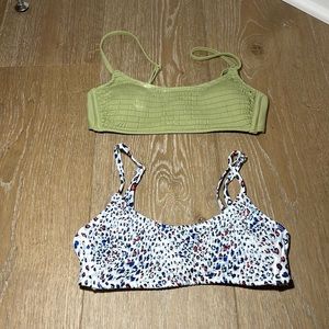 a green bikini top and a red white and blue bikini top